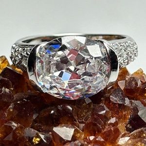 5 ct tw oval CZ ring with surrounding Cz’s set in sterling silver